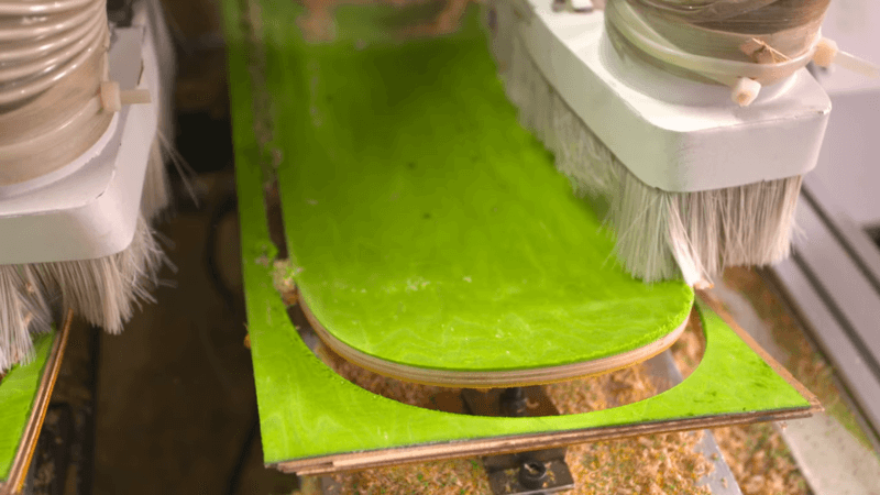 green skateboard are being cut and brushed