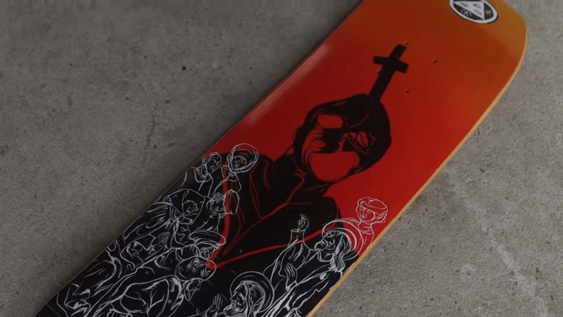 orange custom shaped skateboard decks with Jesus and the cross design